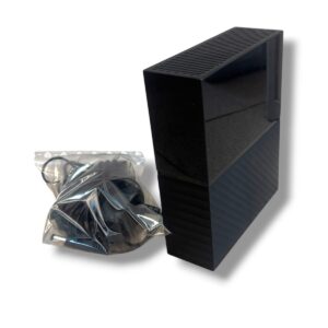 Black vertical rectangular electronic device with vented top and ribbed sides, beside a sealed power adapter in a plastic bag