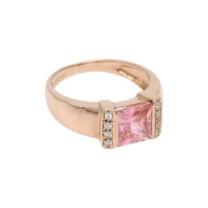 Rose gold ring with a square pink gemstone flanked by small diamonds on the sides; classic engagement-style design