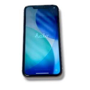 Angle view of a smartphone on a white background, screen showing a blue-teal abstract wallpaper with circular shapes.