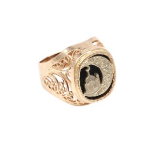 Gold filigree signet ring with black inset and a silver church medallion center