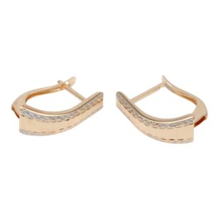 Gold-tone hoop earrings with a curved rectangular shape and a row of faceted diamond-cut accents along the outer edge