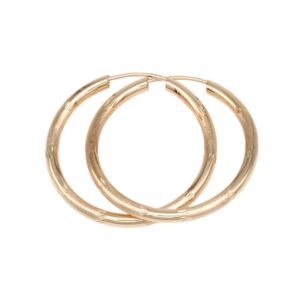 Three gold hoop earrings overlapping on a white background.
