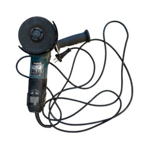 Corded handheld angle grinder with a circular grinding disc and attached power cord.