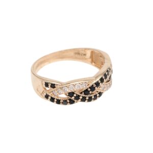 Gold ring with a twisted band set with alternating black and white diamonds.
