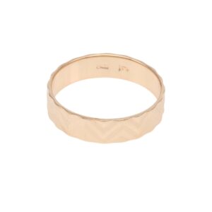 Rose gold ring with a faceted chevron-patterned band, close-up view.
