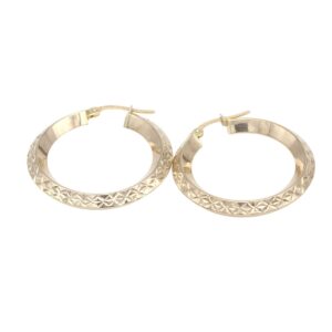 Gold-tone hoop earrings with a faceted, geometric pattern along the outer edge and hinged clasps.