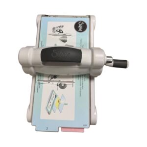 Sizzix die-cutting machine with handle used to cut shapes from paper.