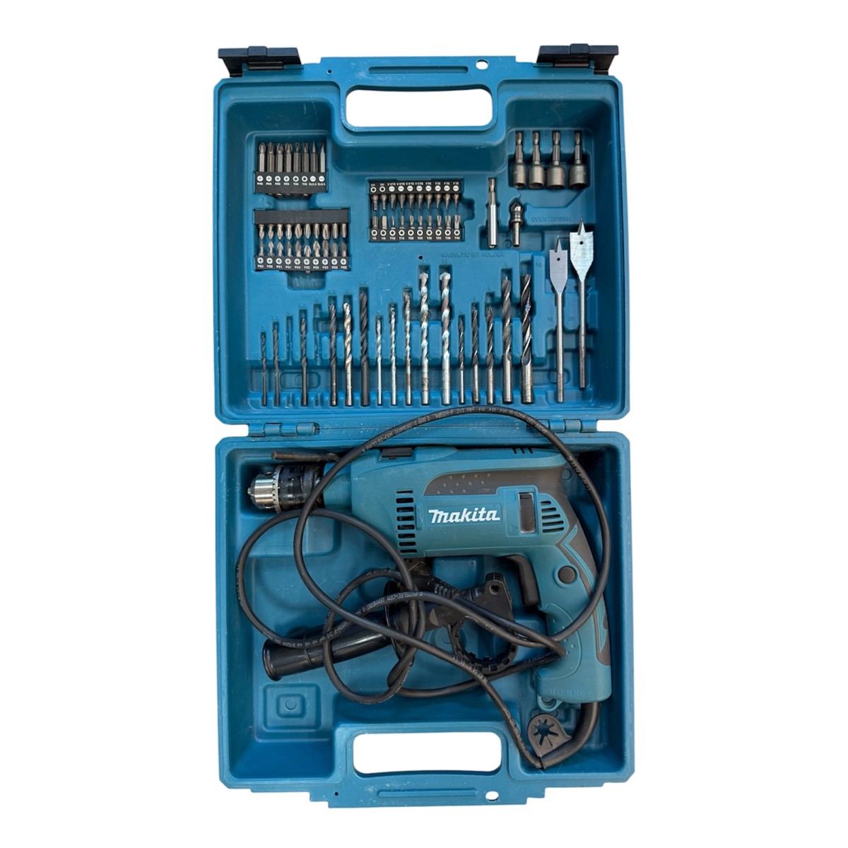 4f6d1f02cfc418ff1038d7bd3a9790a2jpg - Mezola OÜ Blue Makita corded drill kit in an open blue case with assorted drill bits and driver bits. (informative)