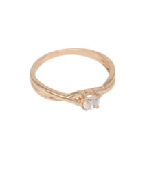 Rose gold engagement ring with a single round diamond in a twisted band setting on a white background