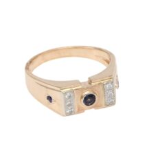 Gold ring with a central blue gemstone and small side diamonds, vintage-style band.