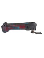 Well-worn cordless oscillating multi-tool with red, blue paint and a metal attachment on the right side