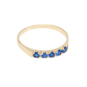 Gold ring with five blue stones set along the top of the band.