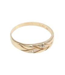 Gold ring with a flowing leaf motif and small diamond accents on the band