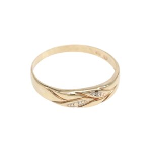 Gold ring with a flowing leaf motif and small diamond accents on the band