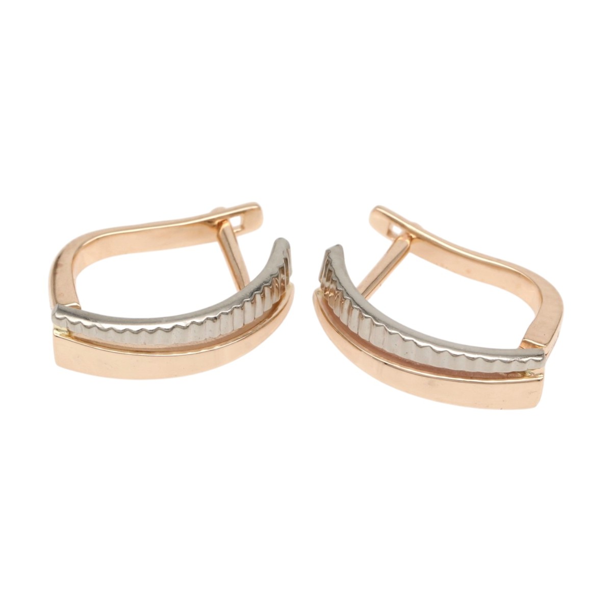 97fab26050adca277c6bc4103023e490jpg - Mezola OÜ Two-tone curved hoop earrings in rose gold with a silver ribbed central bar.