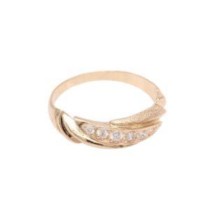 Rose gold ring with a curved band set with small diamonds along one edge, photographed on white.