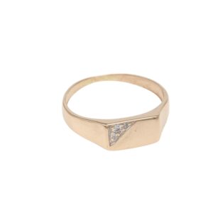 Gold ring with a small diamond-encrusted triangular accent on the top, simple band design.
