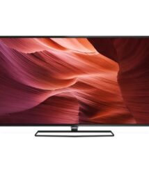 Flat-screen television on a slim metal stand displaying a red canyon wallpaper.