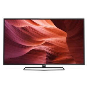 Flat-screen television on a slim metal stand displaying a red canyon wallpaper.