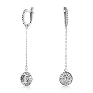 Silver drop earrings with delicate chain and lattice ball charm surrounding a clear gemstone at the end, photographed against white background.