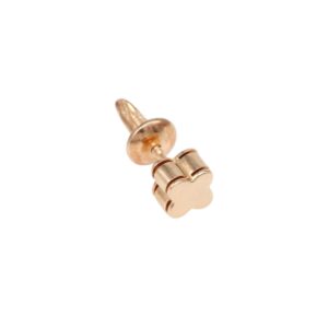 Gold-colored flower-shaped earring back (stud post) close-up, showing screw-style fitting