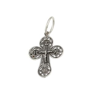 Silver ornate cross pendant with filigree detailing and a small crucified figure on the front.