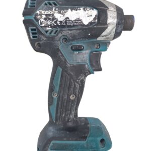 Cordless drill with teal and black casing, dirty and scratched from use.