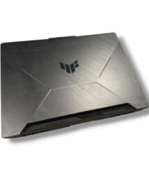 Closed silver gaming laptop with a brushed metal finish and angular panel design, logo on the lid.