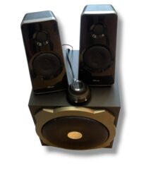 Black 2.1 speaker system with two satellite speakers atop a large subwoofer; round control dial in front.