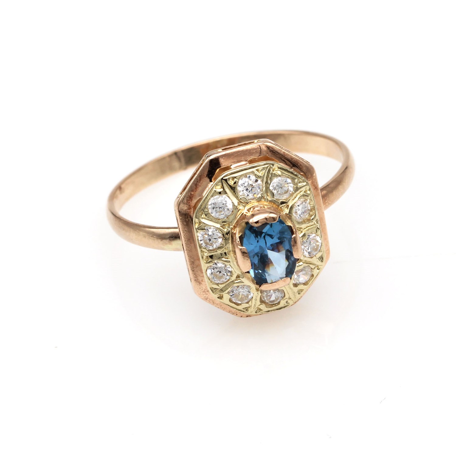 0784c7c18b31b33b873ee727d3d6ef7bjpg - Mezola OÜ Rose gold ring with a blue centerpiece gemstone surrounded by small diamonds in a hexagonal setting