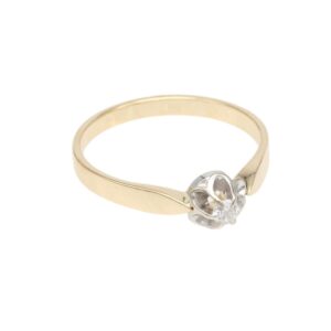 Two-tone gold ring with a silver flower setting and a small diamond at the center