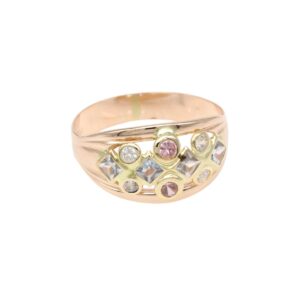 Rose gold ring with a curved band and a cluster of pink and clear gemstones set in gold accents on the front.