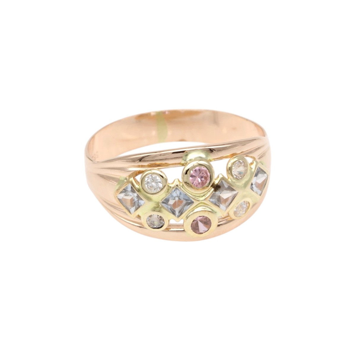 1a2be2e0eea8f0c29e96d68105eec079jpg - Mezola OÜ Rose gold ring with a curved band and a cluster of pink and clear gemstones set in gold accents on the front.