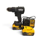 DeWALT cordless drill with two 18V XR batteries and charger on a white background.