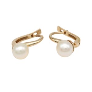 Gold hoop earrings with a single white pearl on each hoop, jewelry for women