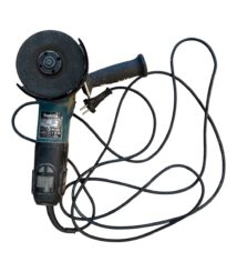 Makita angle grinder with a round abrasive disc and a tangled power cord.