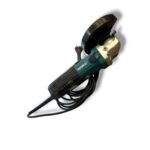 Corded angle grinder with a worn guard and black power cord (Makita brand).