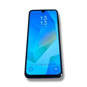 Smartphone displaying a blue geometric wallpaper with time 13:13 and date in Russian on the lock screen, tilted to the left.