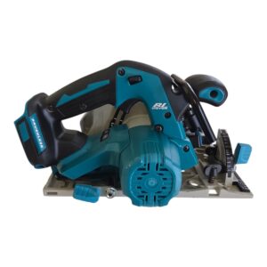 Cordless circular saw with teal body and black handle on a metal base plate ready to cut redwood.