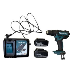 Cordless drill kit with two Makita 18V batteries and a charger on a white background
