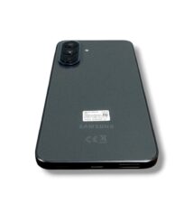 Back view of a dark gray Samsung smartphone with a triple-camera module in the top-left corner and regulatory marks on the back