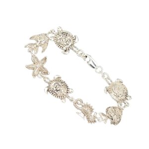 Silver bracelet with filigree marine charms: turtle, seahorse, starfish, and shell beads.