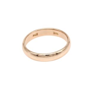 Gold wedding band on a white background, showing a smooth, polished circular ring material jewelry.