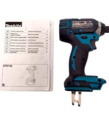 Makita cordless impact driver with instruction manual beside it, showing a teal and black drill and a printed manual