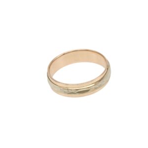 Two-tone gold ring with a faceted, geometric pattern along the outer band against a white background.