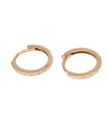 Pair of small gold hoop earrings with a textured, faceted band on a white background