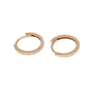 Pair of small gold hoop earrings with a textured, faceted band on a white background