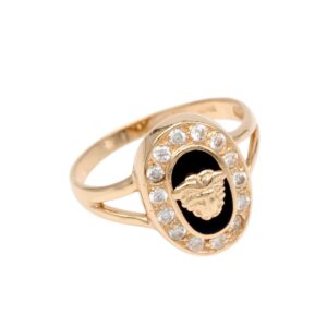 Gold ring with black oval centerpiece showing a raised decorative emblem, encircled by clear rhinestones on a polished band.