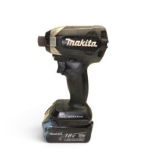 Makita 18V cordless drill with battery attached, viewed from the side on a white background, angled to show the chuck and grip
