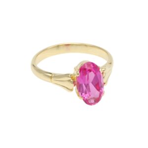 Gold ring with a large faceted pink gemstone centerpiece in yellow metal band
